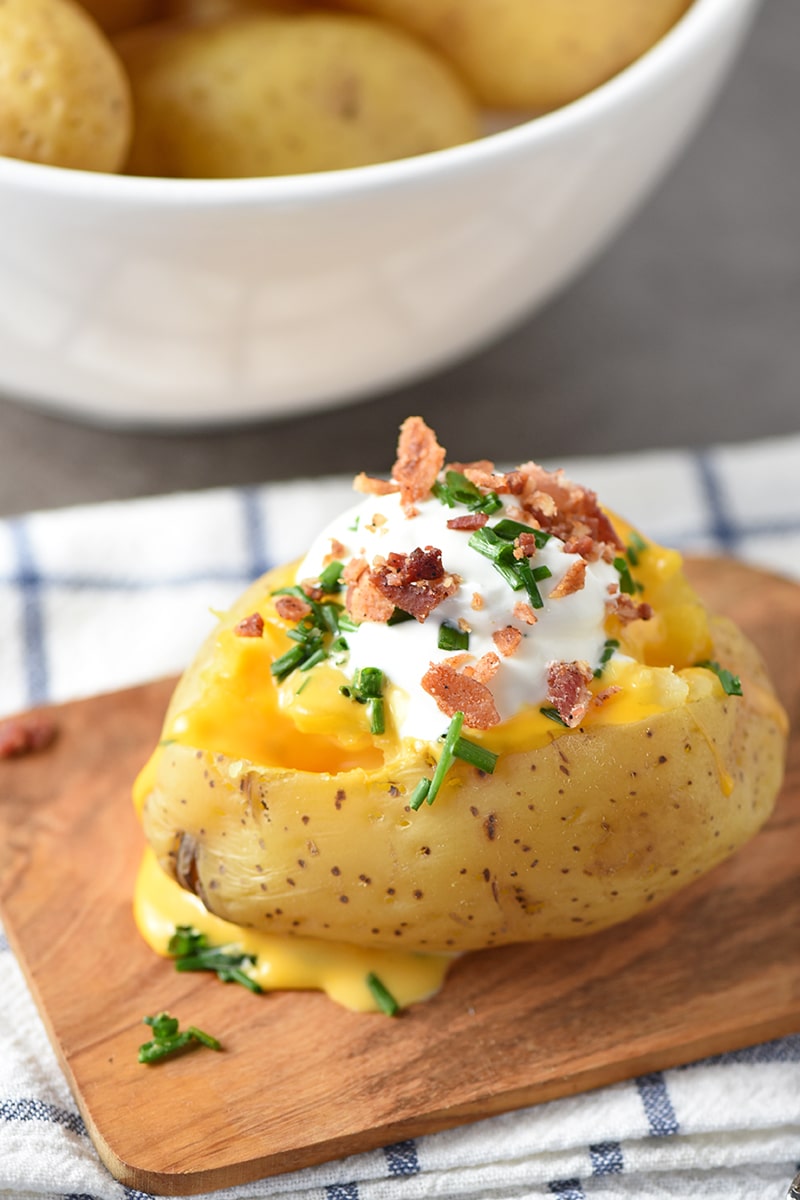 Create the Ultimate Baked Potato Bar for your next Game Day, party, family get together, or potluck. Printable list of delicious toppings ideas!