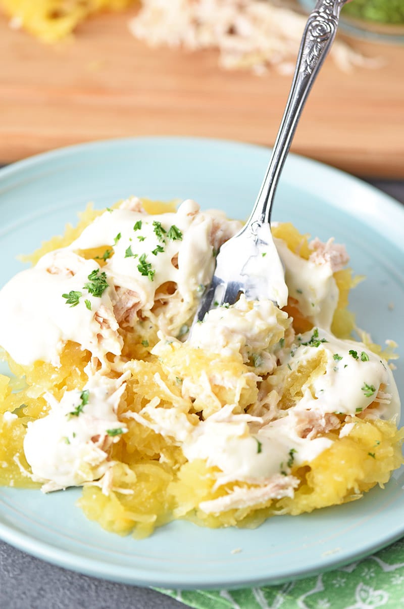 spaghetti squash chicken alfredo on a plate with fork