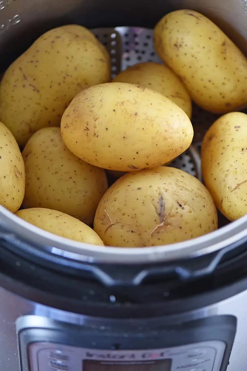 Instant Pot recipes, including baked potatoes using Instant Pot accessories like a steamer basket