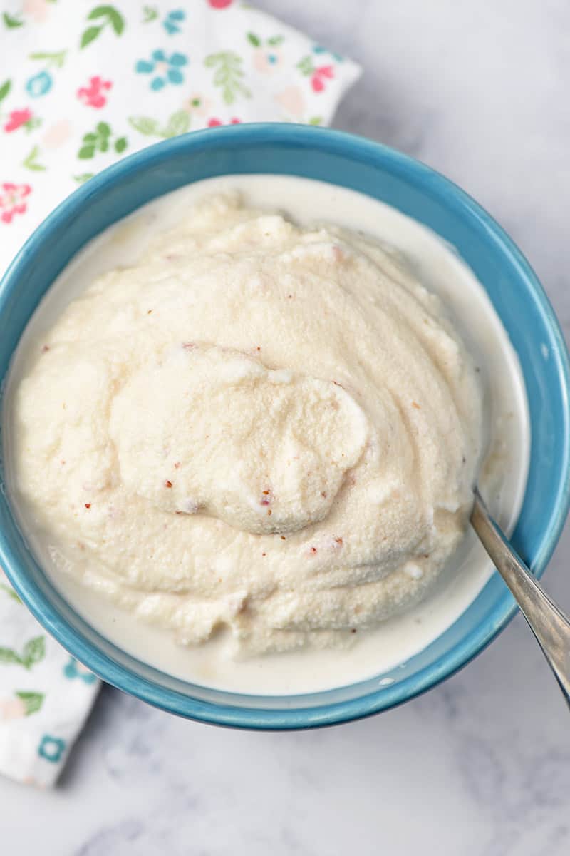 blue bowl of old-fashioned homemade strawberry ice cream