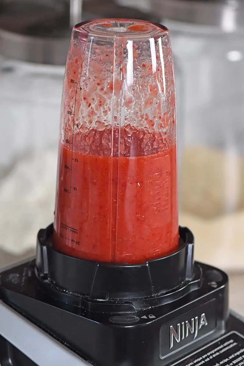 puree strawberries in Ninja blender for strawberry sauce