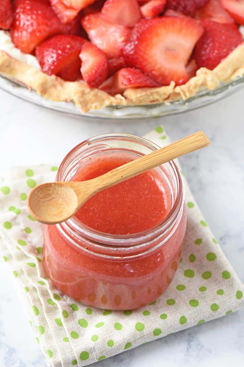 mason jar of strawberry sauce for cheesecake
