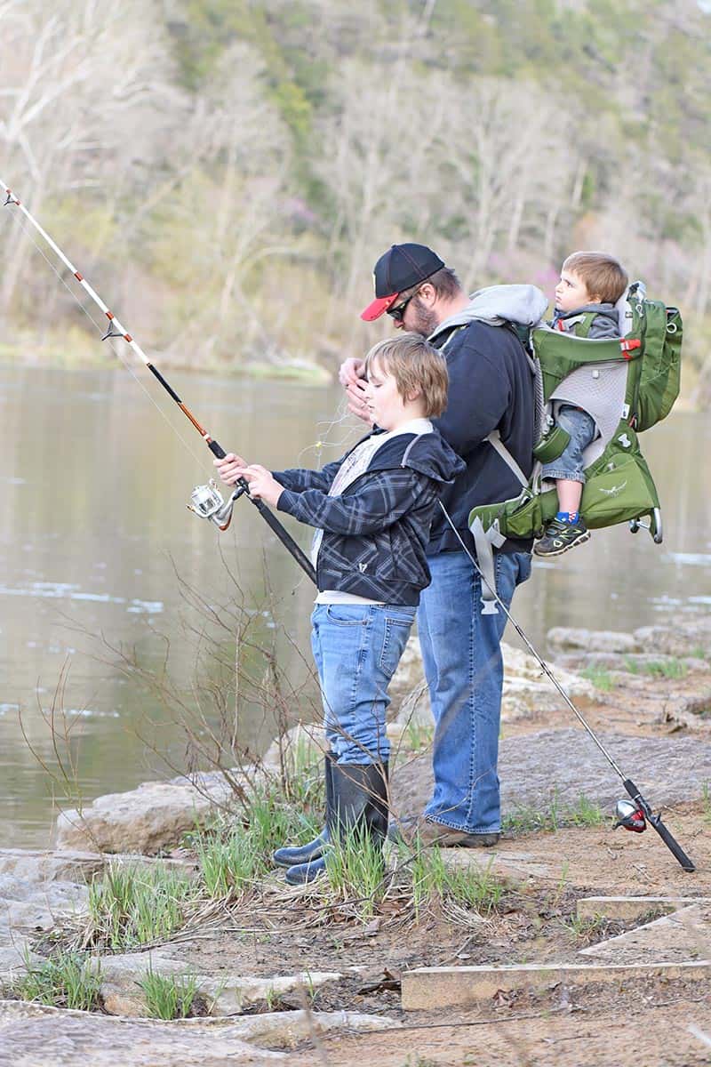 fishing with kids and toddler in an Osprey baby and toddler carrier