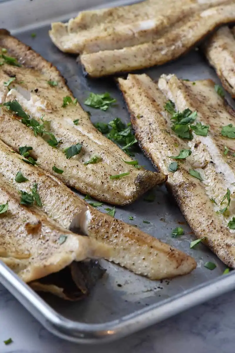 grilled fish fillets recipe, cooked ad placed on a baking sheet