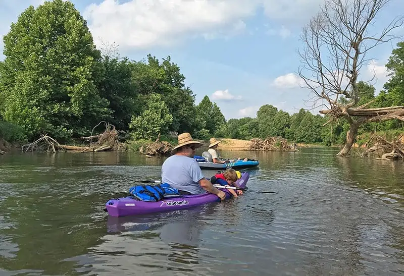 family kayaking on Illinois River near Siloam Springs, Arkansas