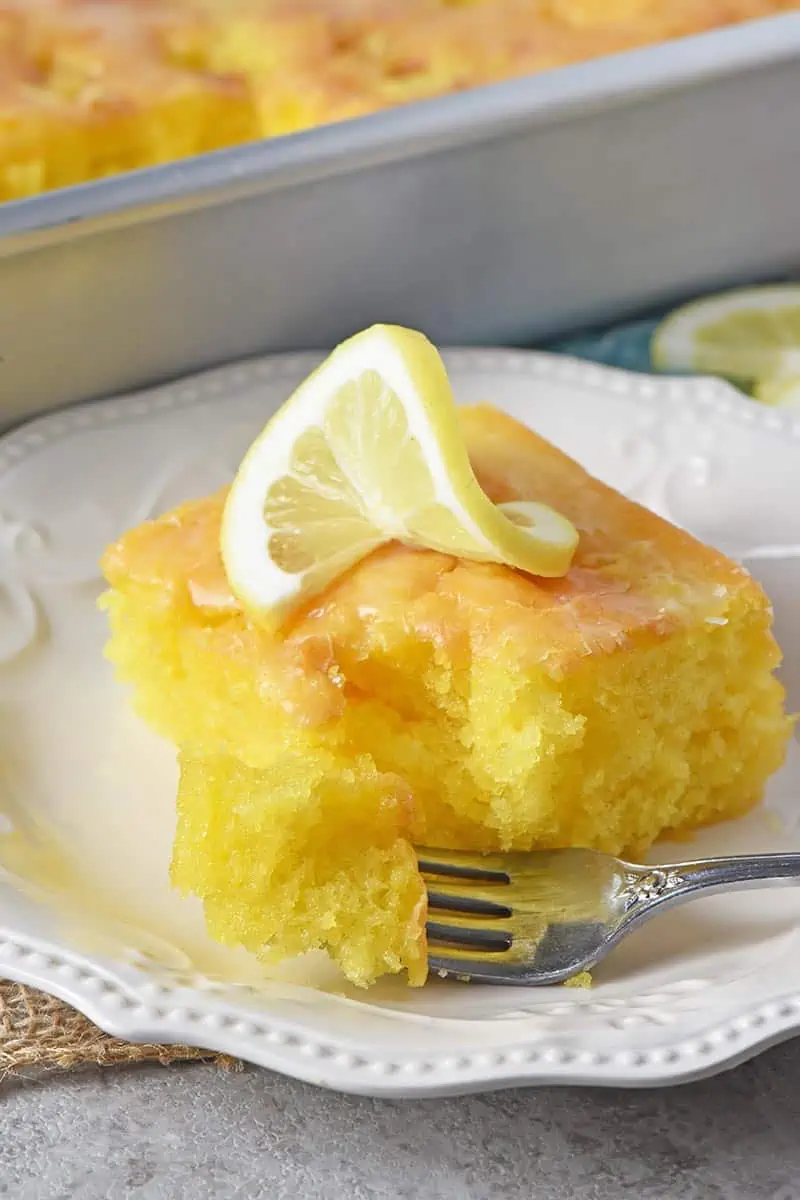 slice of lemon cake with bite on fork