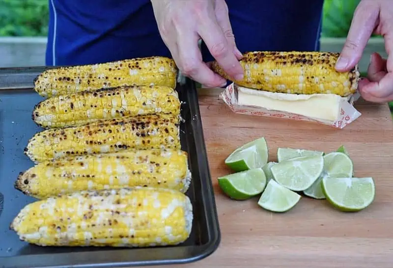 Butter ears of grilled corn on the cob for Mexican corn on the cob recipe