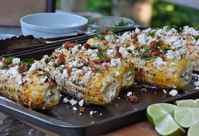 crumbled bacon on Mexican corn