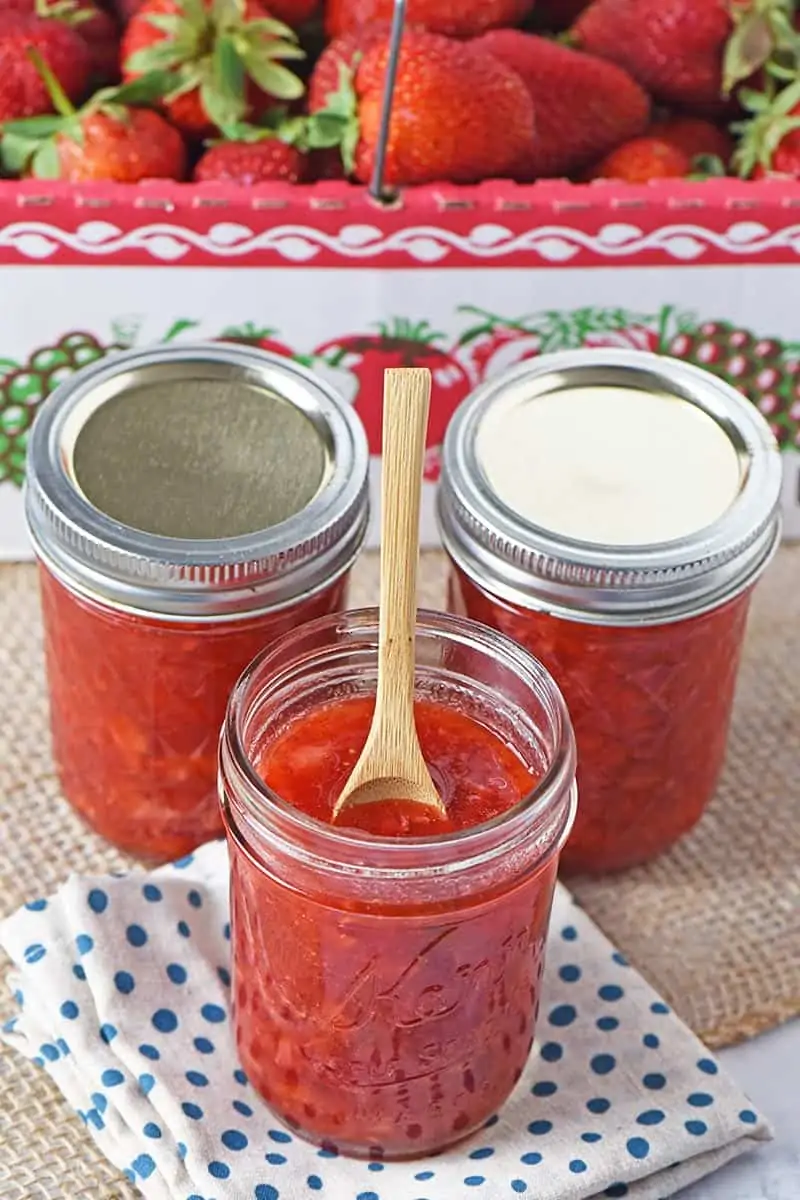 how to make strawberry jam in minutes, jars of fresh homemade freezer jam