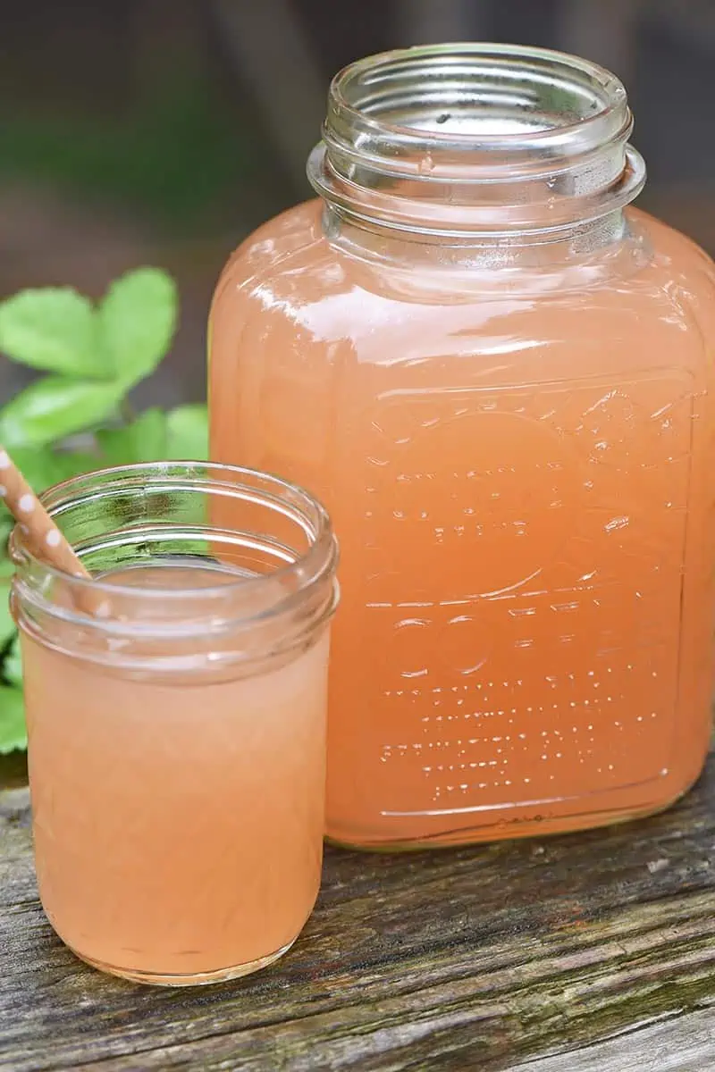 homemade apple juice in a Sunshine Brand Coffee jar and jelly jar