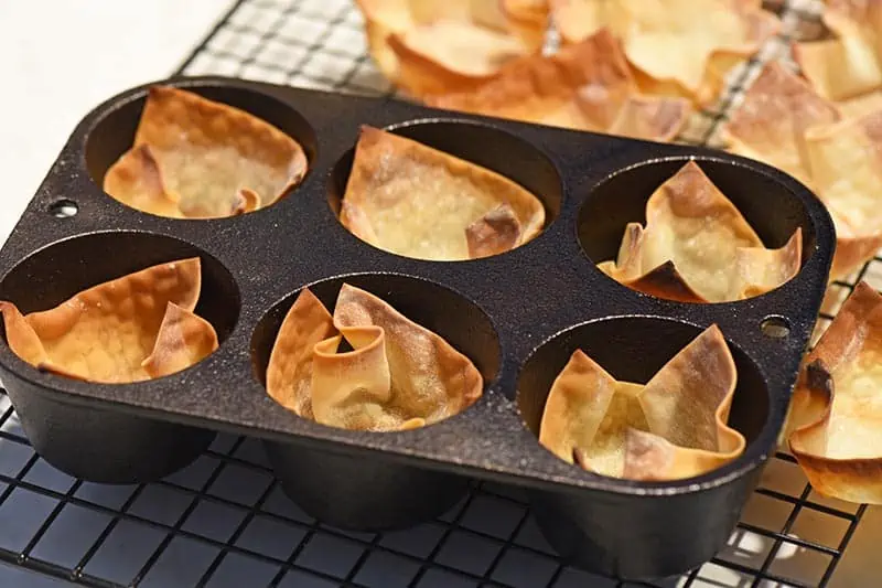 baked wonton cups in cast iron muffin pan
