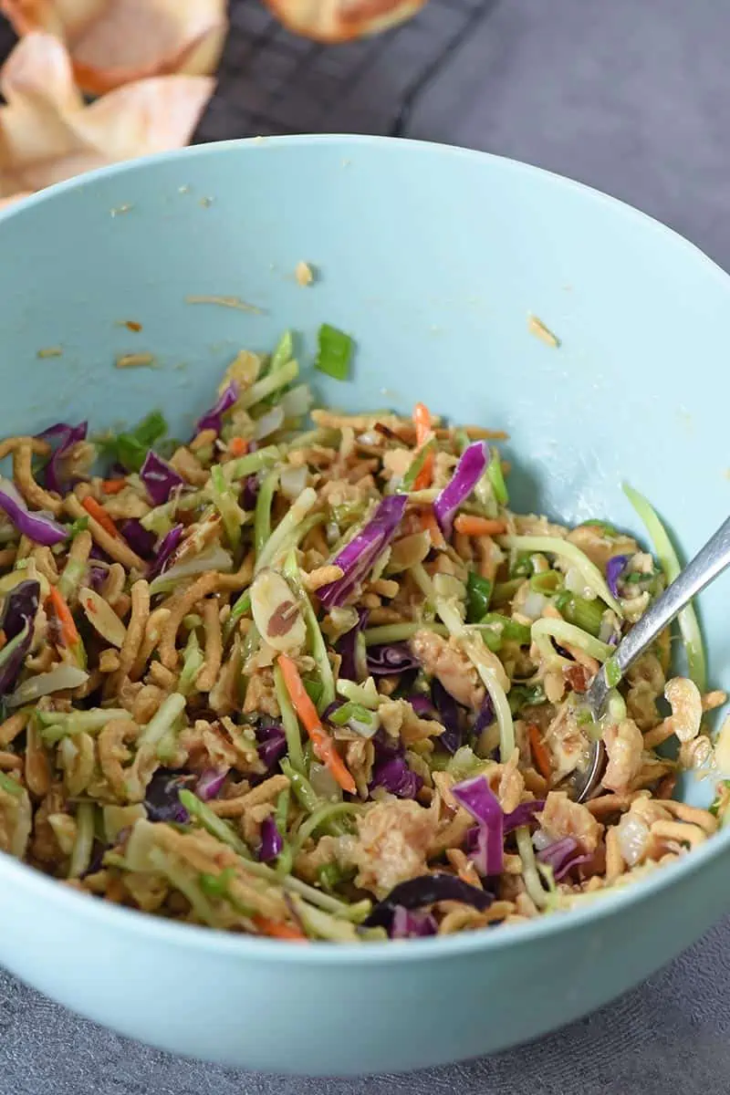 easy Asian salad recipe in blue mixing bowl