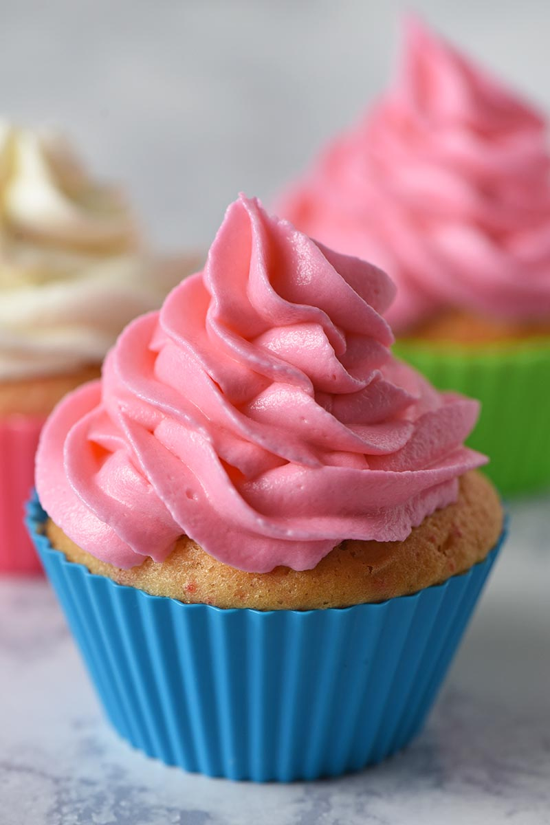 how to make the best buttercream frosting ever, pink buttercream icing on a cupcake