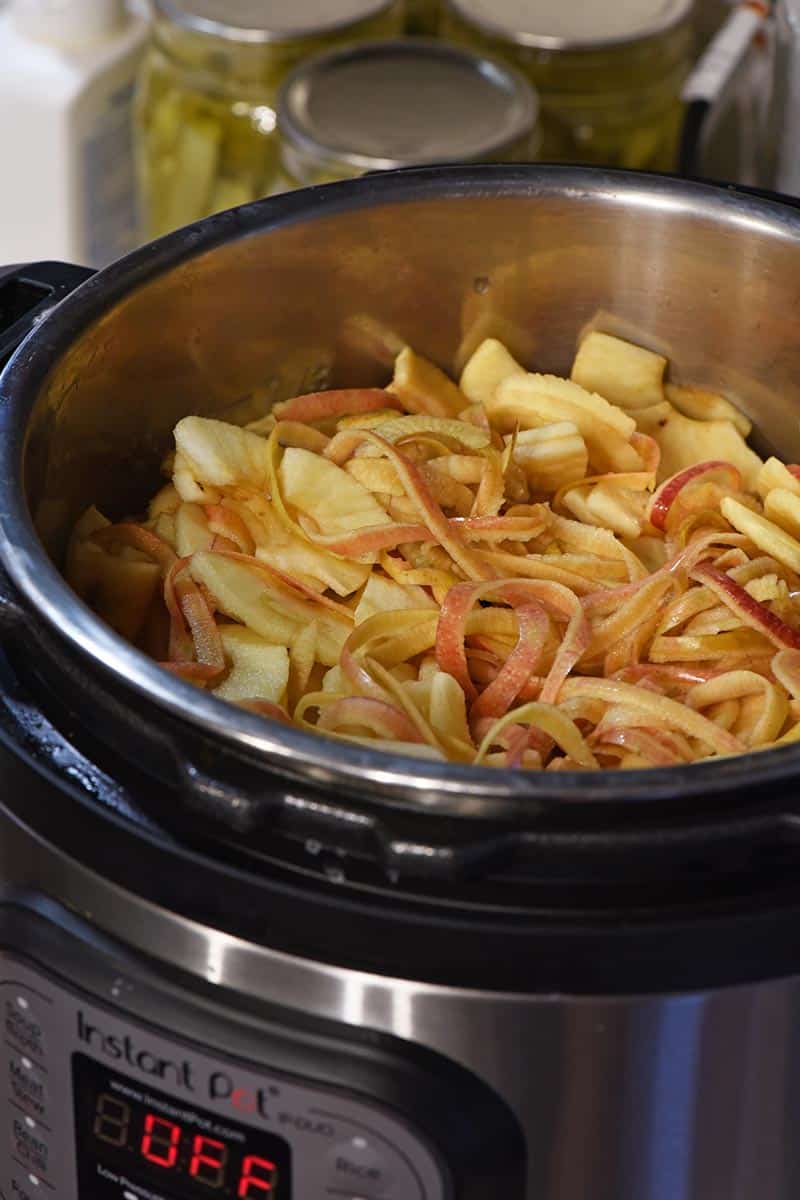 how to make homemade apple juice in your Instant Pot with the whole apple, including core and peelings