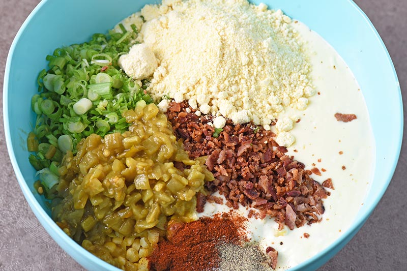 ingredients for baked Mexican corn casserole in mixing bowl