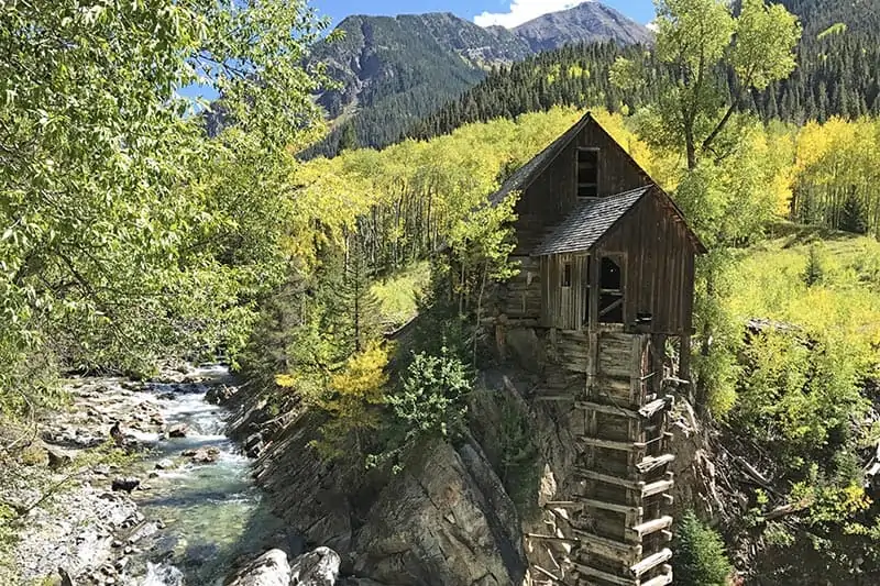 gorgeous Crystal Mill surrounded by yellow aspens in Colorado