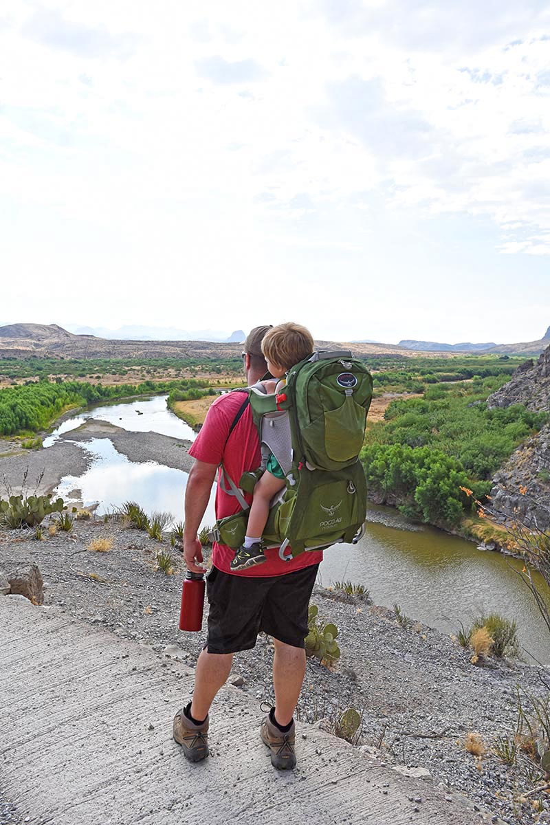 dad with toddler in hiking carrier enjoying a view of Big Bend from Santa Elena Canyon Trail