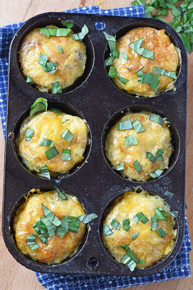 sausage egg muffins in a cast iron muffin tin