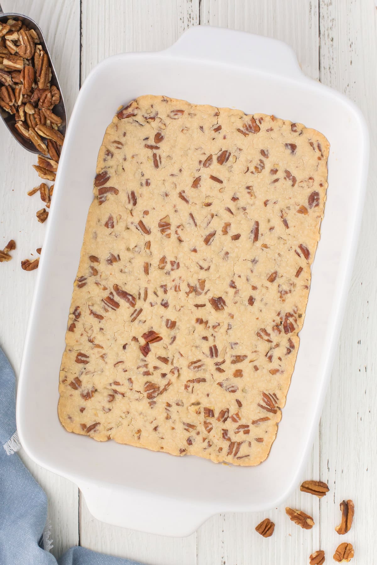 press-in pecan nut pie crust in a white 9x13 baking pan