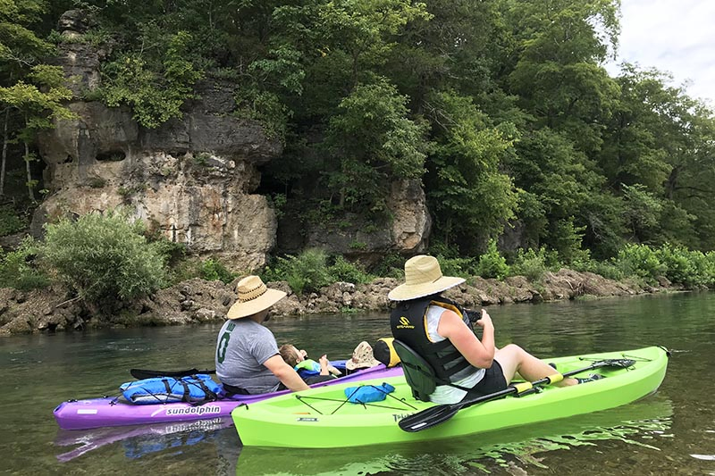 kayaking next to a bluff on the Jacks Fork River from Alley Spring to Eminence, MO