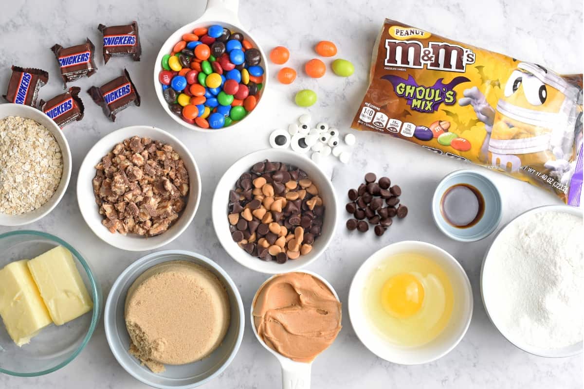 monster cookies recipe ingredients on white marble countertop