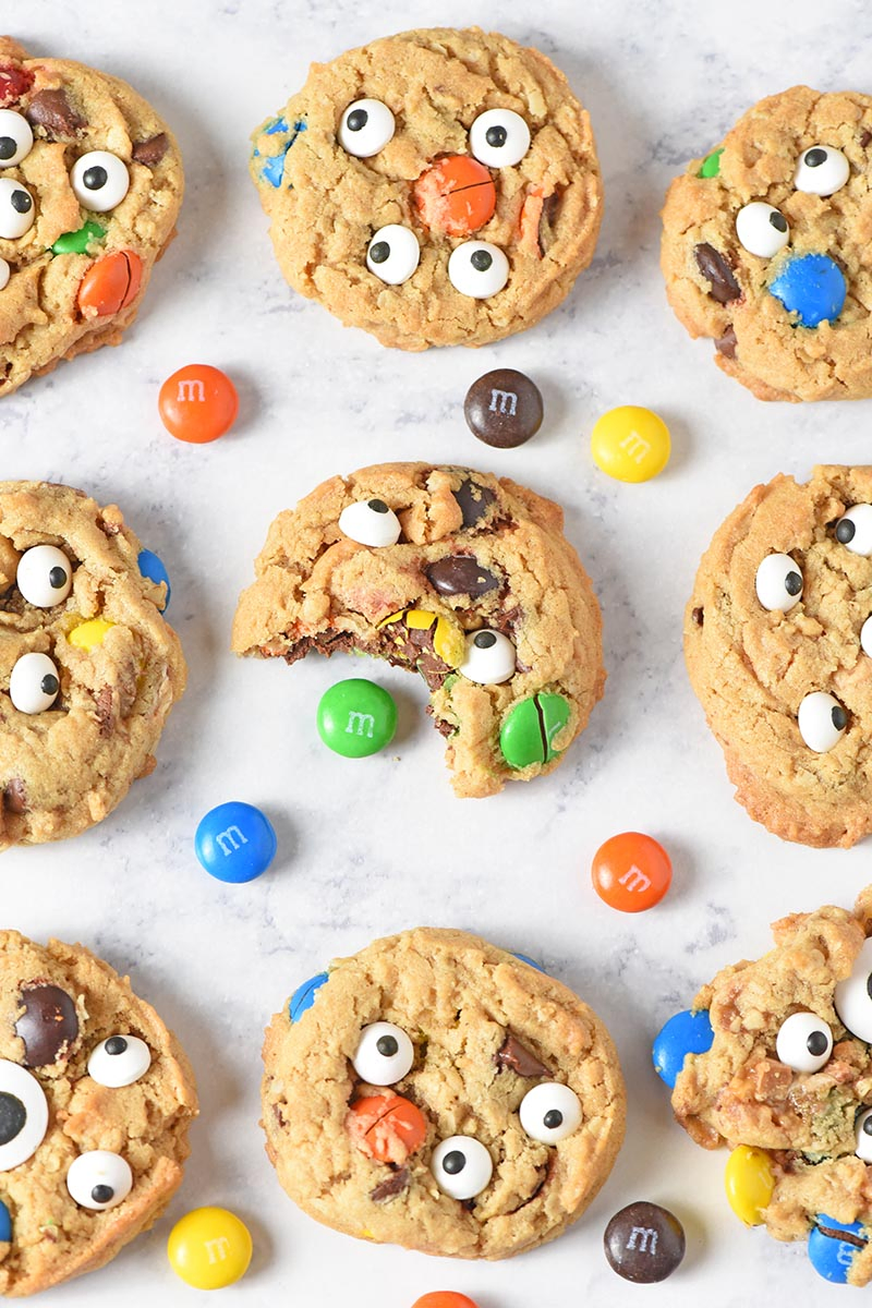 chewy monster cookies with M&M'S candies on white marble countertop
