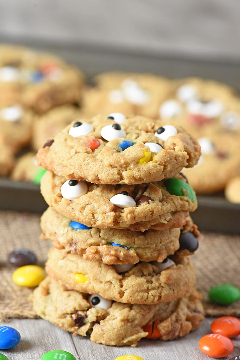 stack of monster cookies made with halloween candy and candy eyeballs