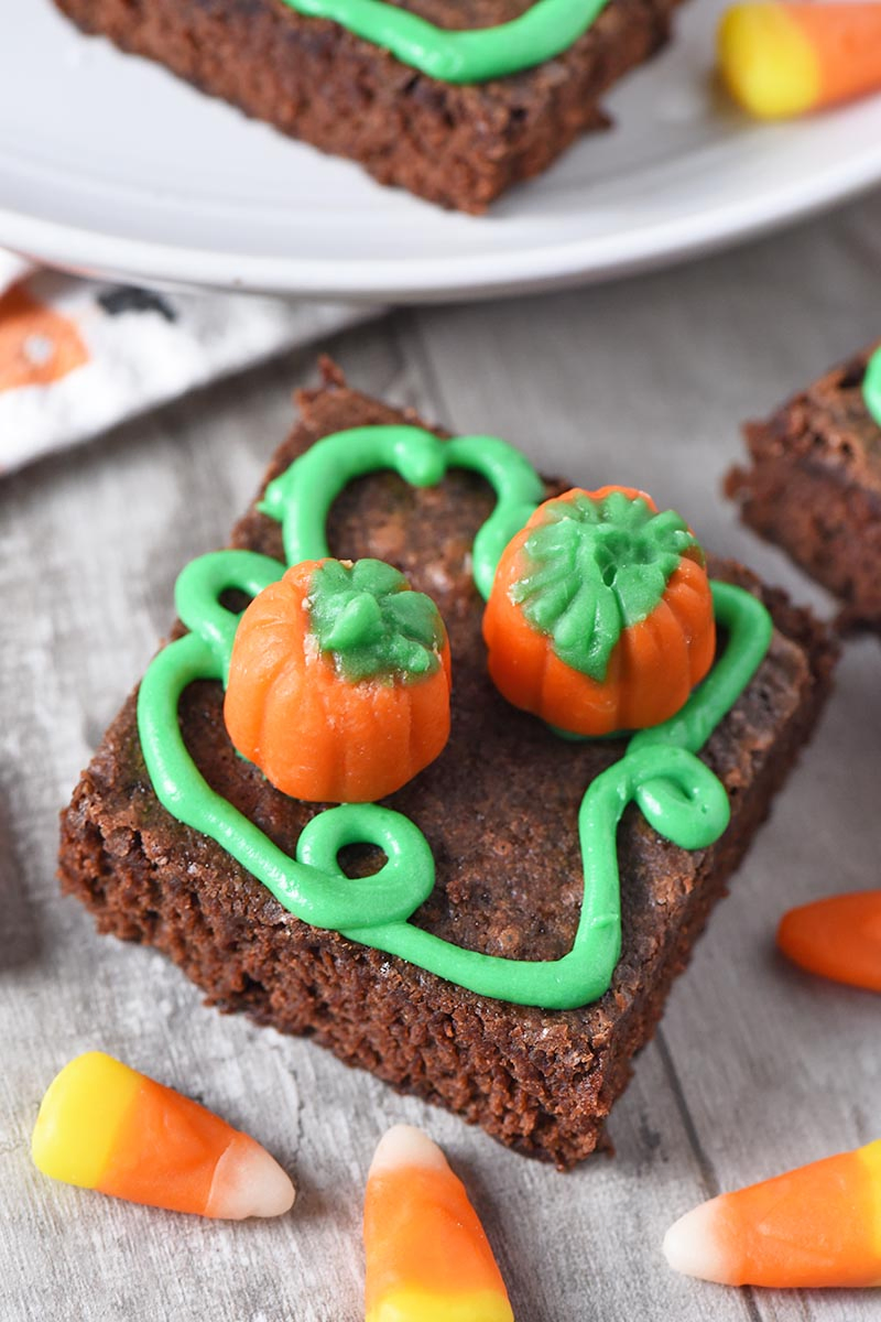 finished pumpkin patch halloween brownies with candy corn pumpkins and green icing pumpkin vines