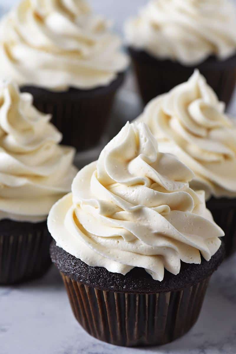 chocolate cupcakes with swirls of butterbeer buttercream frosting on top