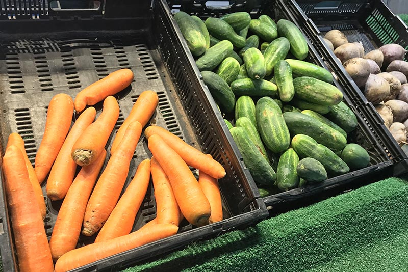 carrots, cucumbers, and potatoes at Soulard Market, St. Louis Farmer's Market in Missouri