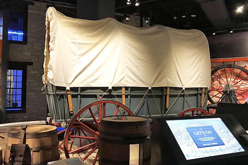 covered wagon exhibit in the Gateway Arch Museum in St. Louis, Missouri