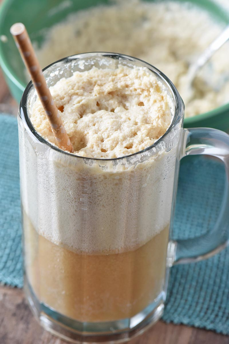 quick and easy butterbeer recipe with frothy whipped cream in glass mug
