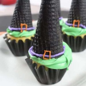 witch hat cupcakes on white platter
