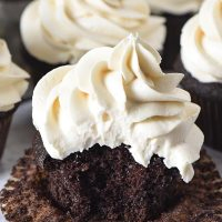 bite out of moist and fluffy chocolate cupcakes with butterbeer buttercream frosting