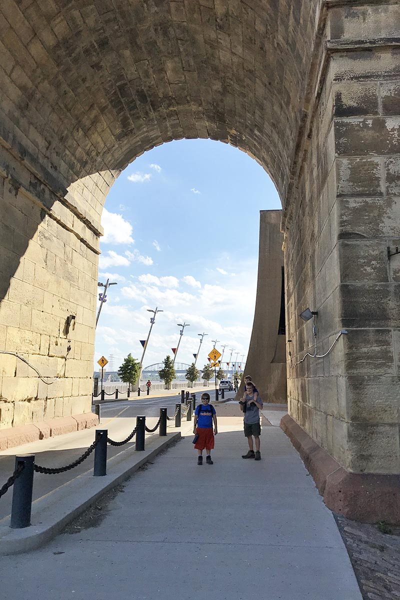 walking through the arches of Eads Bridge to the Arch in St. Louis, Missouri
