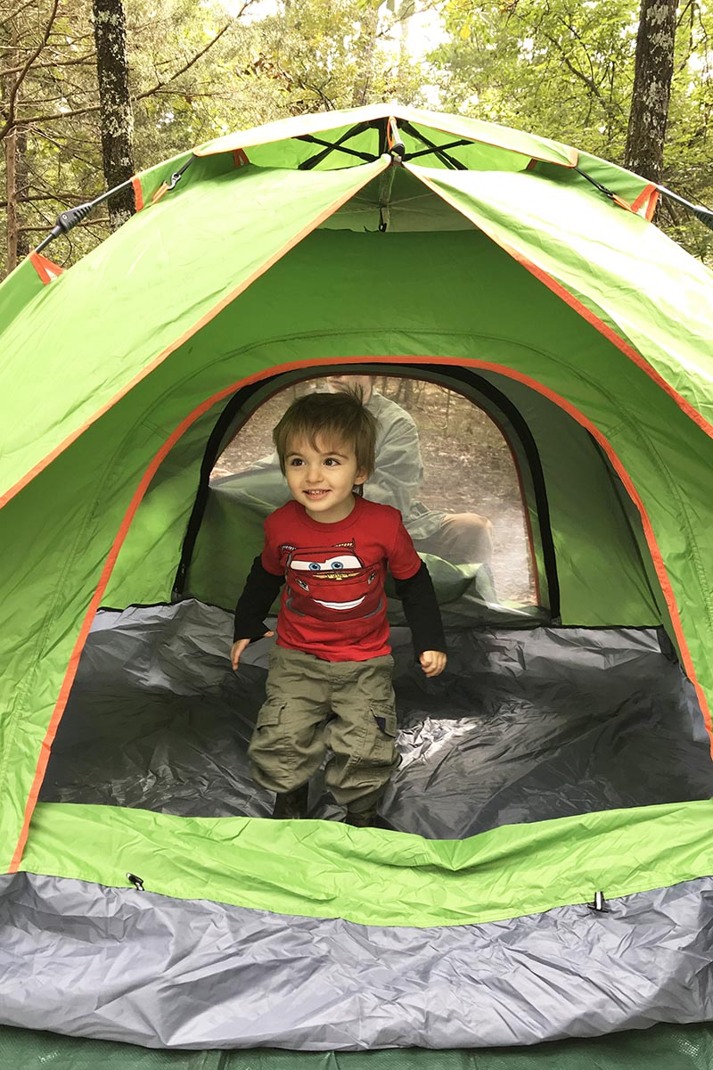 toddler in ground tent in Petit Jean State Park campsite