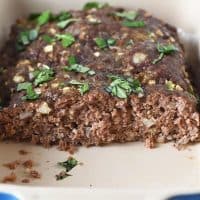 sliced homemade low carb meatloaf in blue baking dish