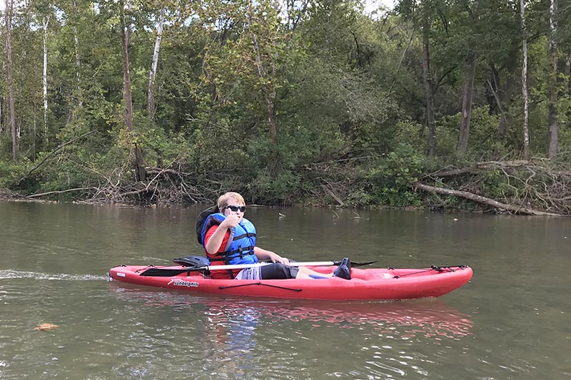 boy kayaking the Current River from Akers Ferry to Pulltite Campground
