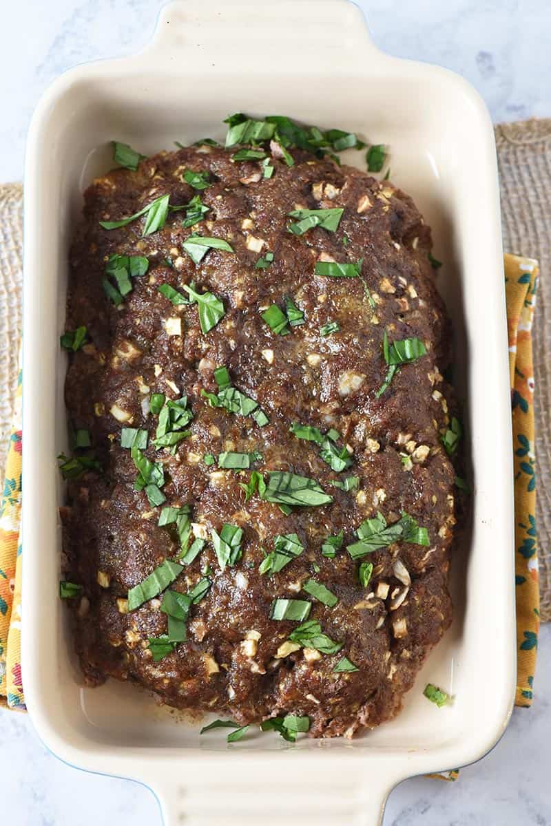 low carb meatloaf baked and resting in baking dish