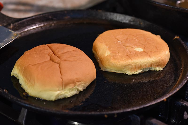 toasting hamburger buns in a little bit of bacon grease on cast iron griddle for the most delicious sloppy joes