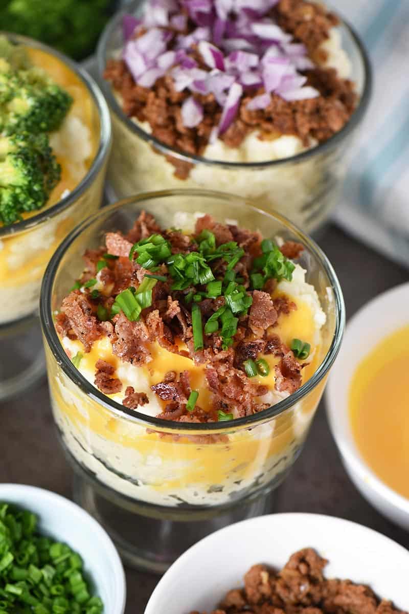 bacon and cheese topping for mashed potato bar in small glass trifle dish