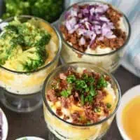 mashed potato bar toppings with small glass trifle bowls of mashed potatoes