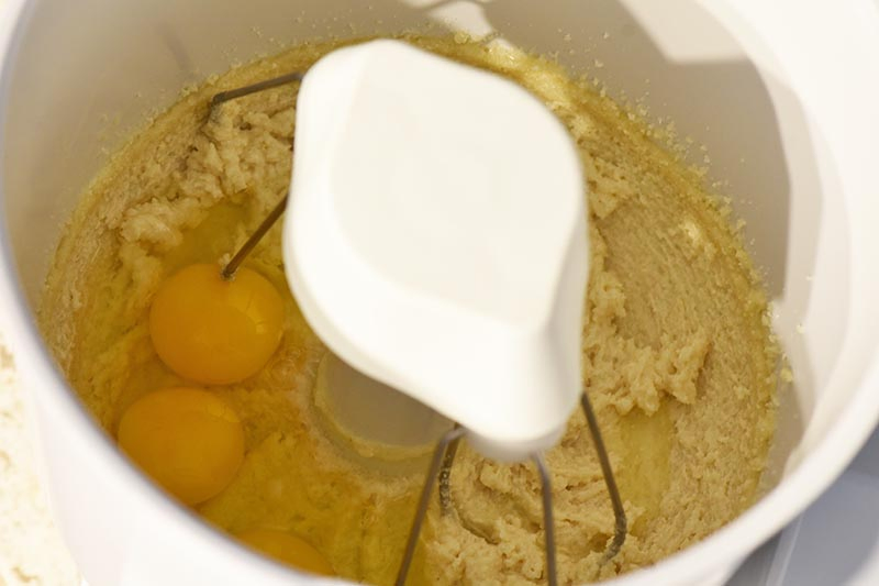 mixing eggs into pumpkin bread recipe dough with WonderMix kitchen mixer
