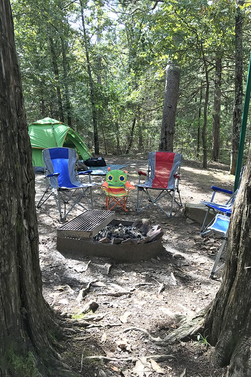 campsite with fire ring and camping chairs at Petit Jean State Park