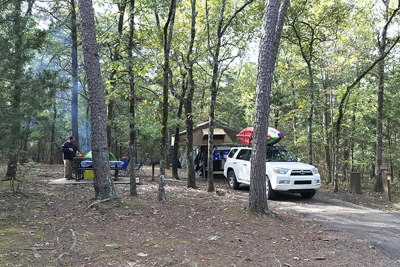campsite with rooftop tent at Petit Jean State Park, one of our favorite Arkansas state parks