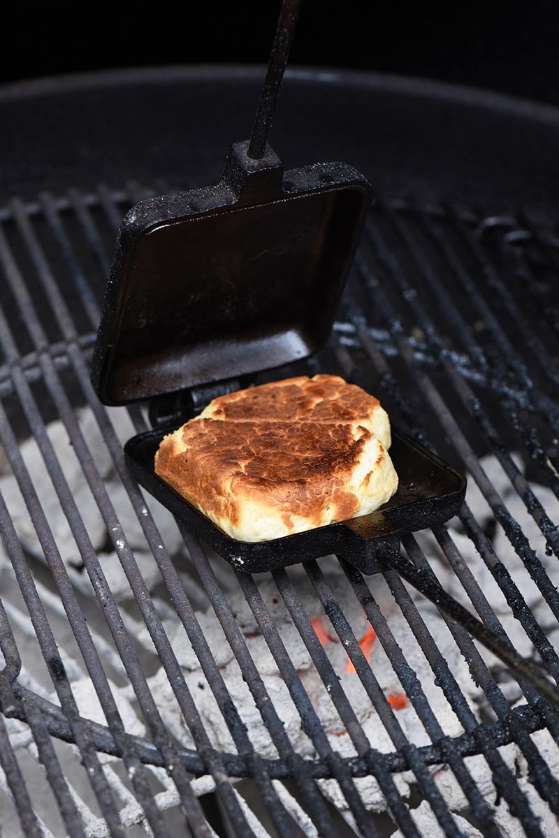 pie iron recipe for drop biscuits and cooking drop biscuits in a pie iron for campfire food