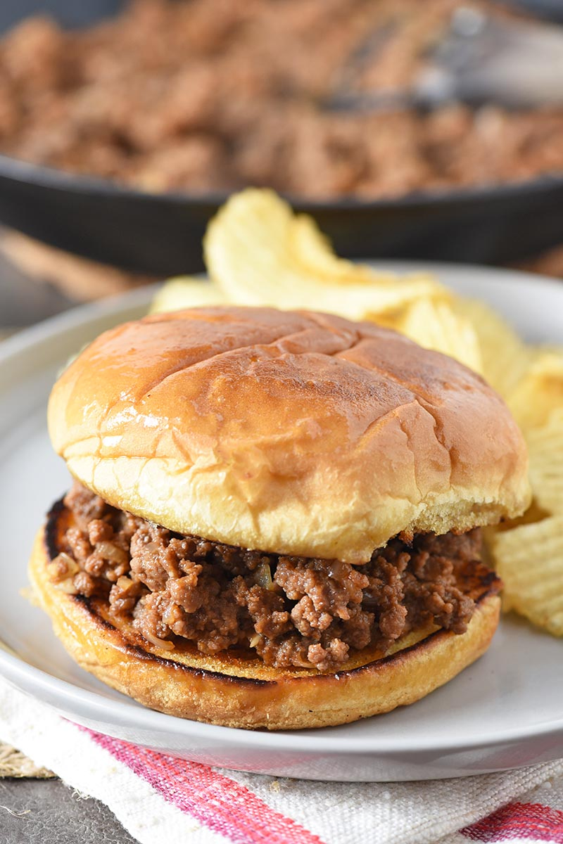 homemade sloppy joes on plate with potato chips