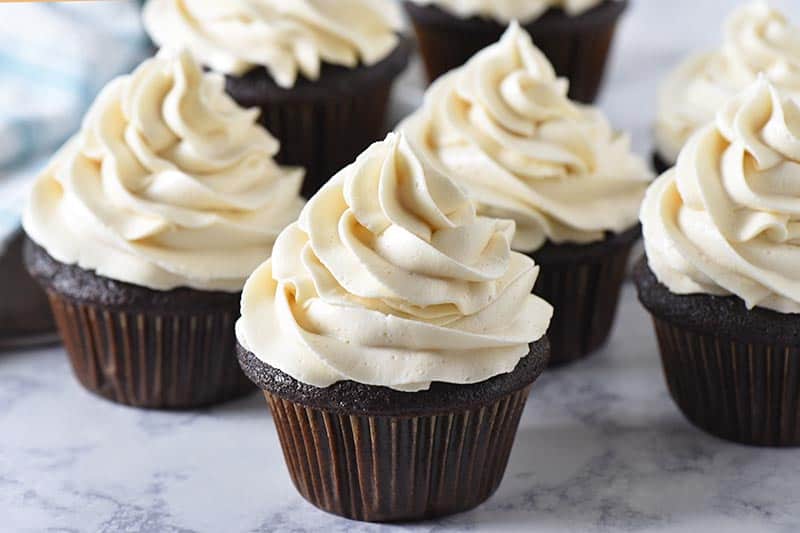 swirled butterbeer buttercream frosting on chocolate cupcakes
