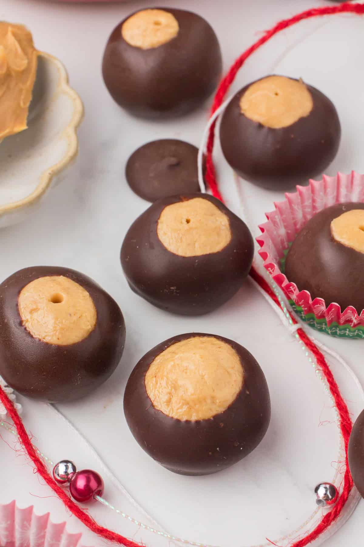 buckeyes on a gray countertop with festive Christmas decor
