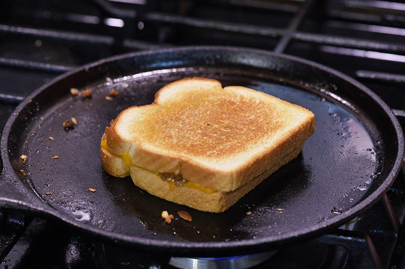 grilled cheese sloppy joes frying on cast iron griddle